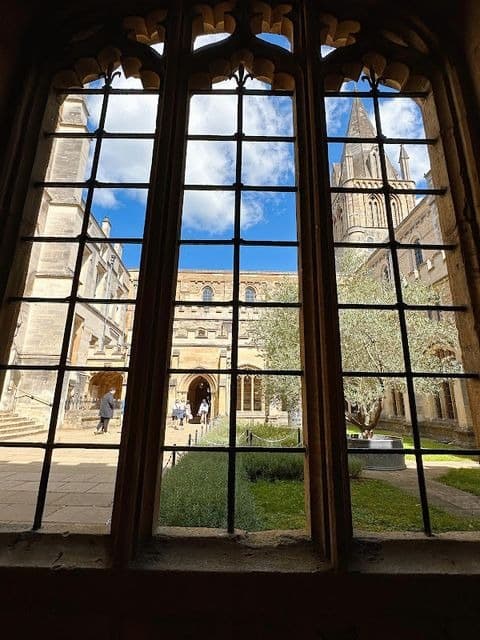 A tall college window looking out over Oxford