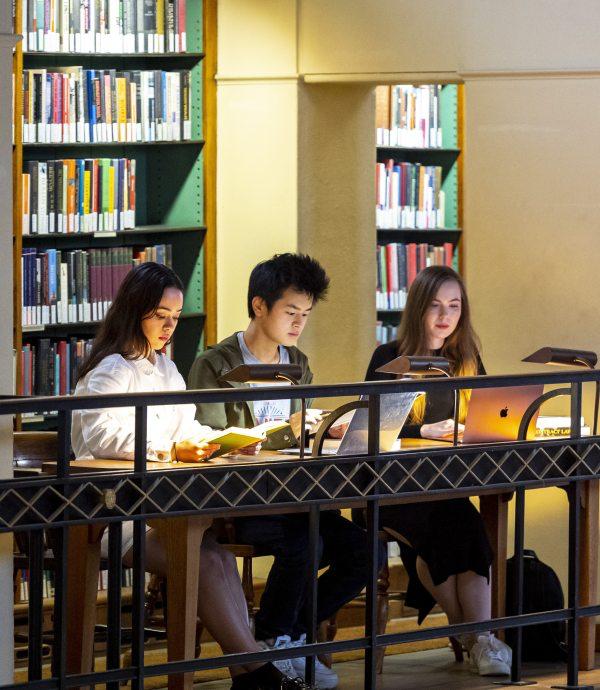 Students studying together in a college library