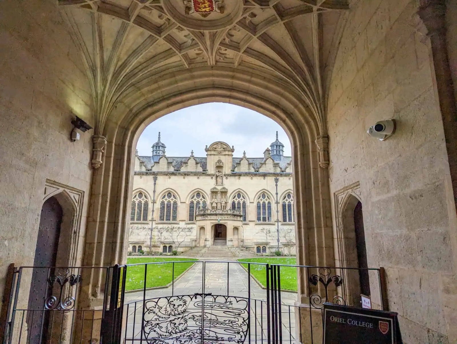 A vaulted archway looking through to a college quad